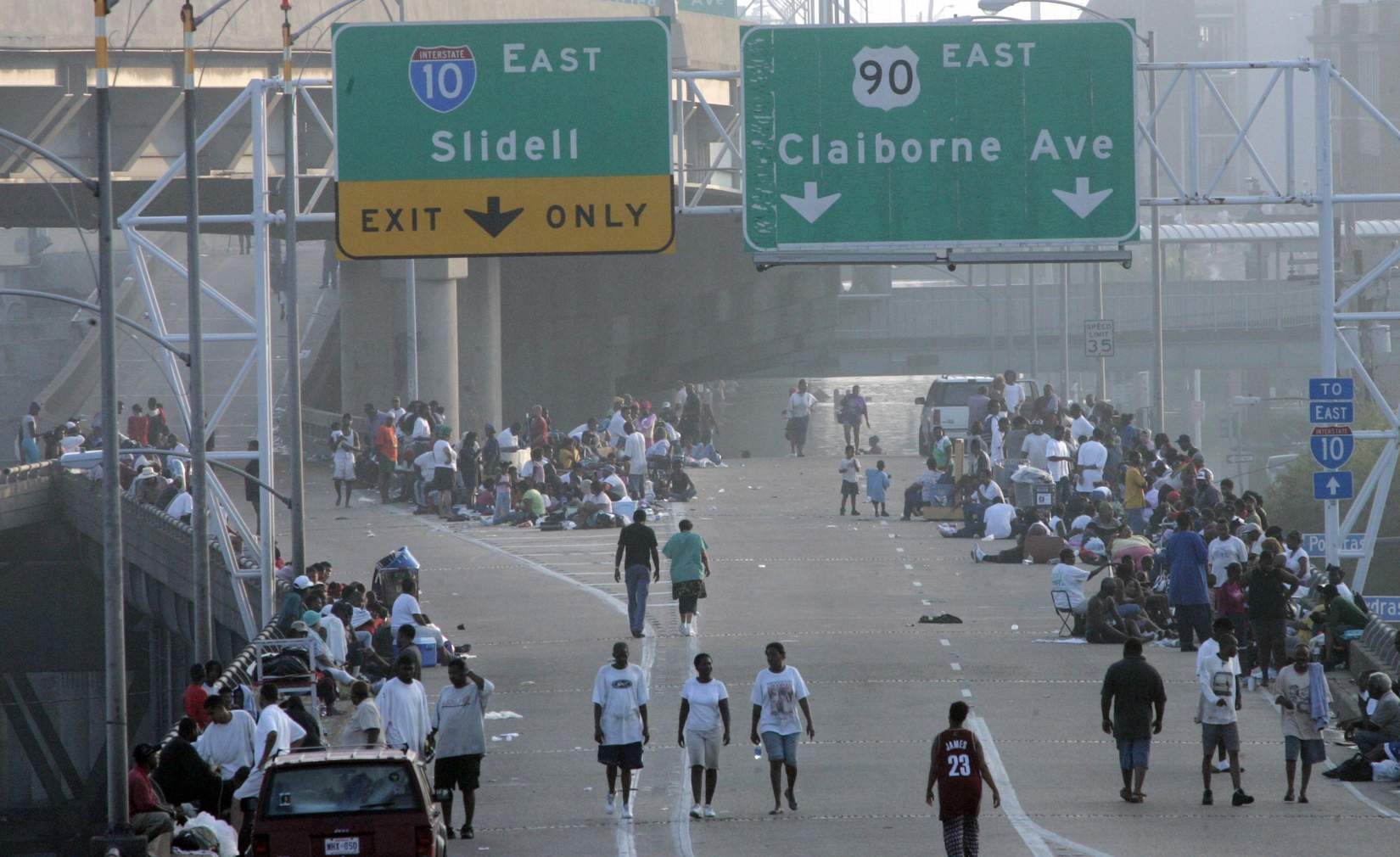 New Orleans residents take refuge on an overpass as the flood waters rise. Source: Dallas Daily News